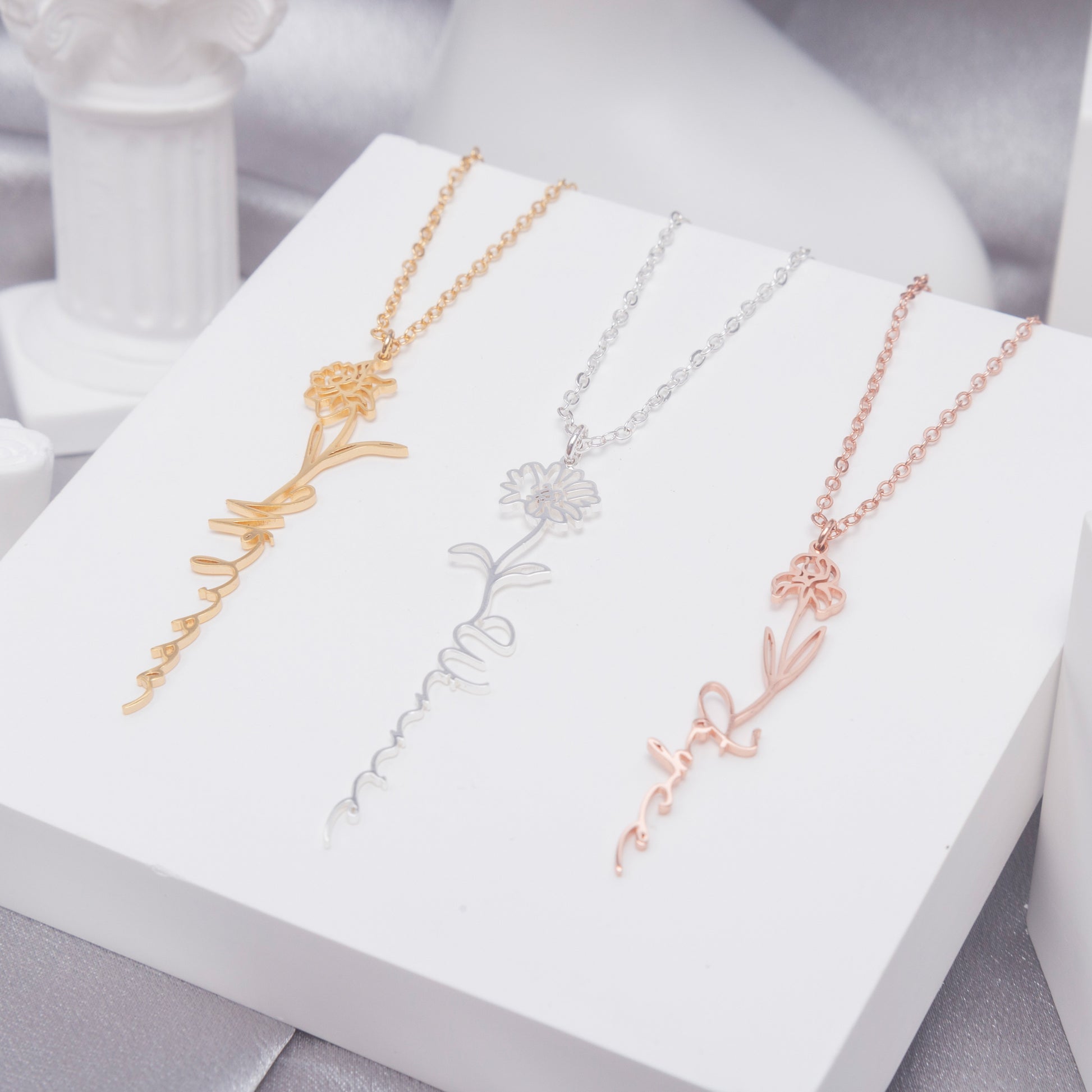 Close-up of a Personalized Birth Flower Name Necklace in Copper, showcasing the intricate Lily of the Valley detail and delicate chain. (Focuses on a specific birth flower and the craftsmanship)