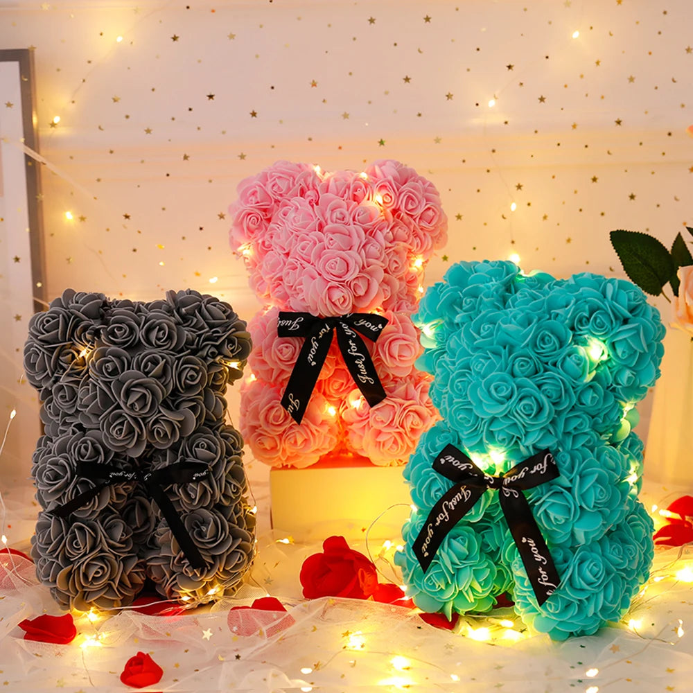 Rose Bear Gift: 25cm LED Teddy with artificial flowers, boxed.