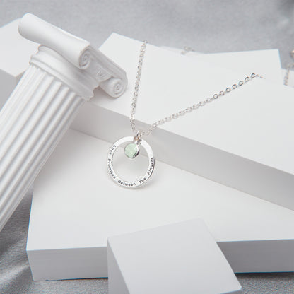 Close-up of a shimmering [Birthstone Name/Color] personalized birthstone necklace, nestled in its elegant gift box, ready for gifting. (Focuses on the visual detail of the close-up and the gifting aspect.)