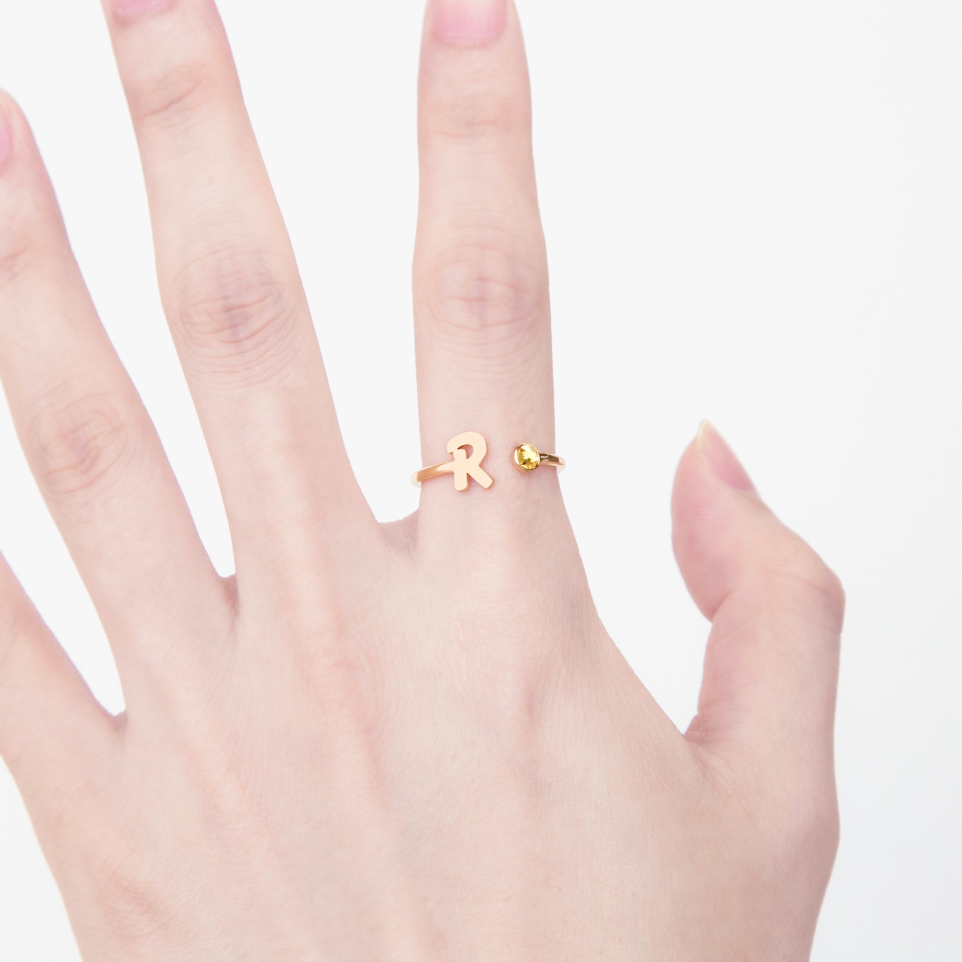 Side View of a Personalized Engraved Initial Ring in 14k Gold, displaying the band's thickness and 'J' initial depth. (Specifies view, metal type, specific letter, and highlights key features like thickness and engraving depth)