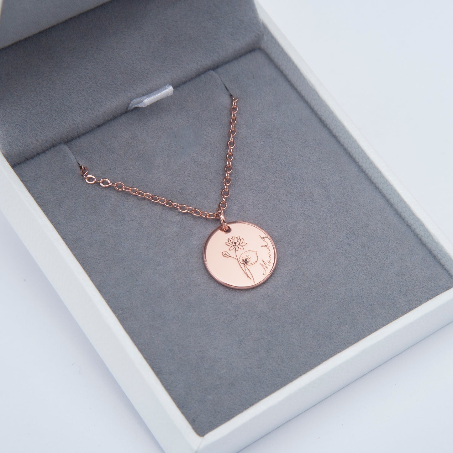 Back of the dainty floral copper necklace pendant, showing the smooth, polished copper surface. (Offers a complete view of the product, appealing to thorough shoppers)