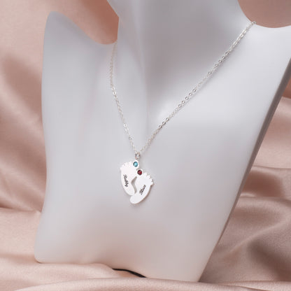 Infant Footprint Necklace - Sterling Silver (Chain Detail):Focus on the delicate cable chain of this sterling silver personalized infant footprint necklace, displayed alongside its gift box packaging.