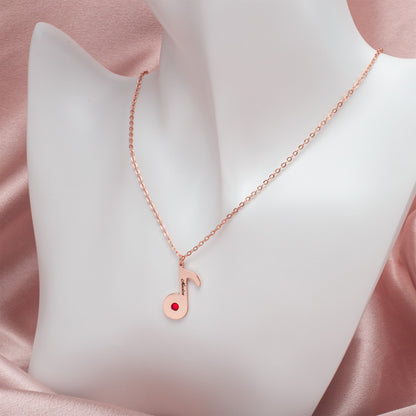 Lifestyle shot: Woman wearing a stainless steel music note necklace, paired with a casual white t-shirt and jeans. (Focuses on usage and style, assuming a lifestyle shot)