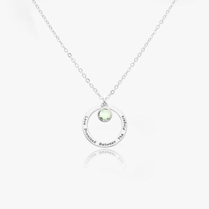 Personalized birthstone necklace made of stainless steel, showcasing [Birthstone Name/Color] birthstone. Presented in a gift box.