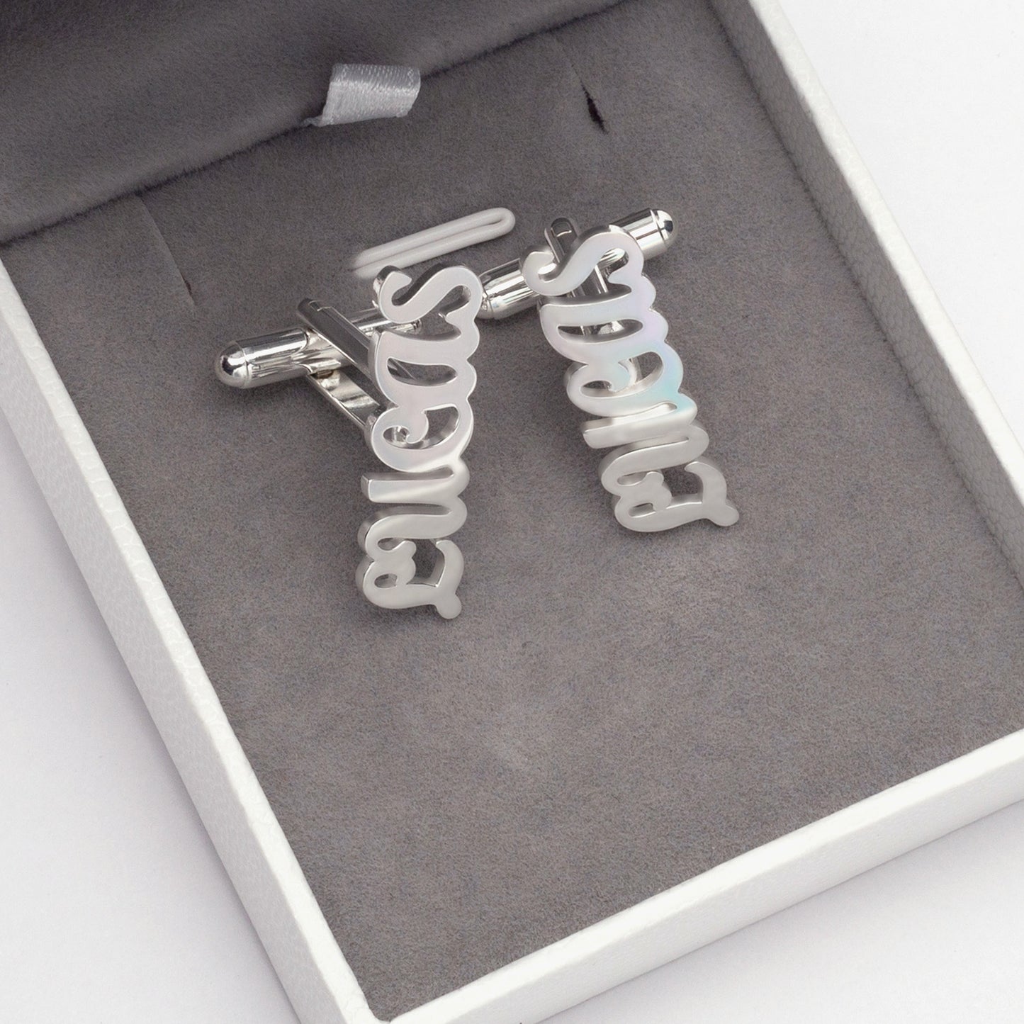 Close-up of Personalized Sterling Silver Cufflinks Engraved with "G.S." – Showcase Gift Box Detail. (Focuses on visual detail, reinforces material and personalization, mentions gift box subtly)