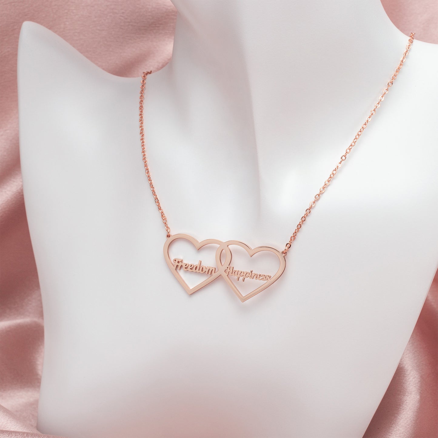 Gleaming Sterling Silver Double Heart Name Necklace with personalized engraving.Customize with two names for a unique keepsake. (Emphasizes material quality and the customization aspect)