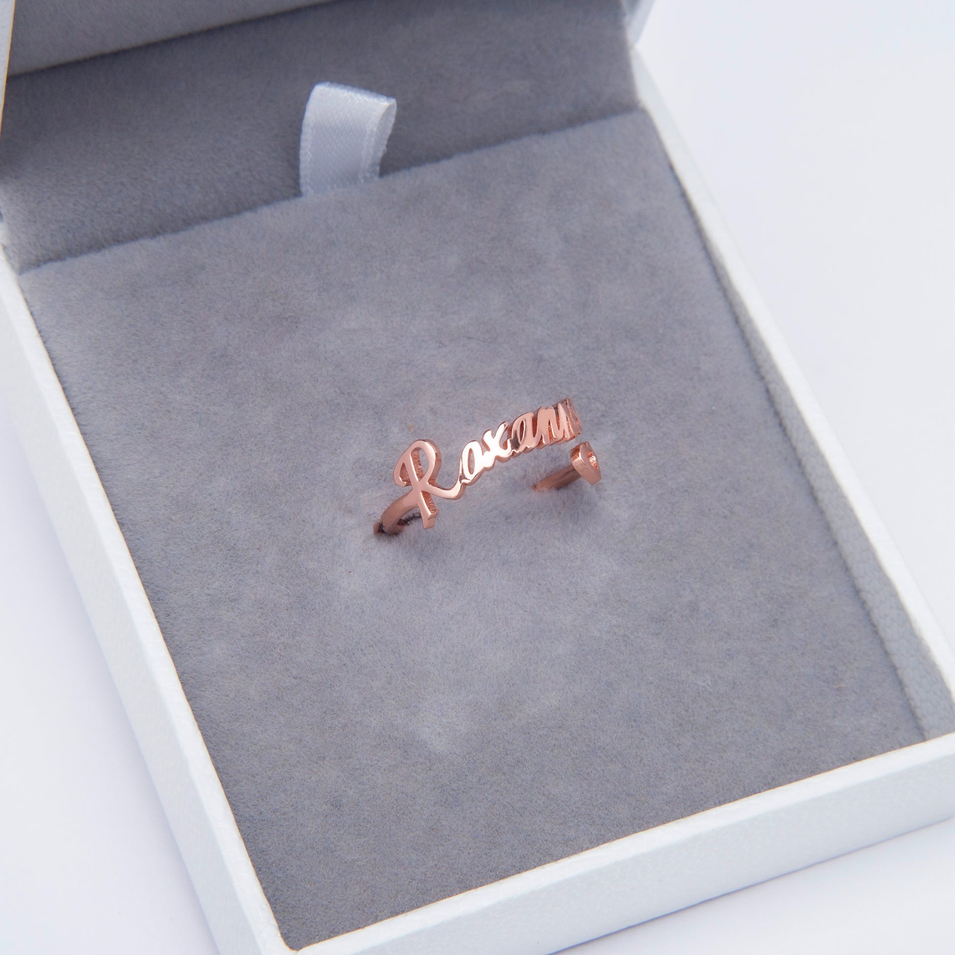 Copper Personalized Heart Name Ring on Hand - displaying adjustable band for a perfect fit. (Emphasizes adjustability and reiterates material and core product)