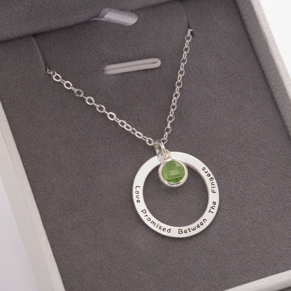 Detailed view of the engraved personalization on a [Birthstone Name/Color] birthstone necklace, highlighting the custom touch of this stainless steel gift. (Emphasizes the personalization feature and the material.)