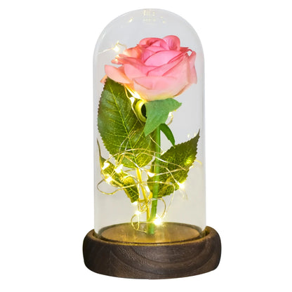 Preserved rose in glass dome, soft LED glow, romantic gift.