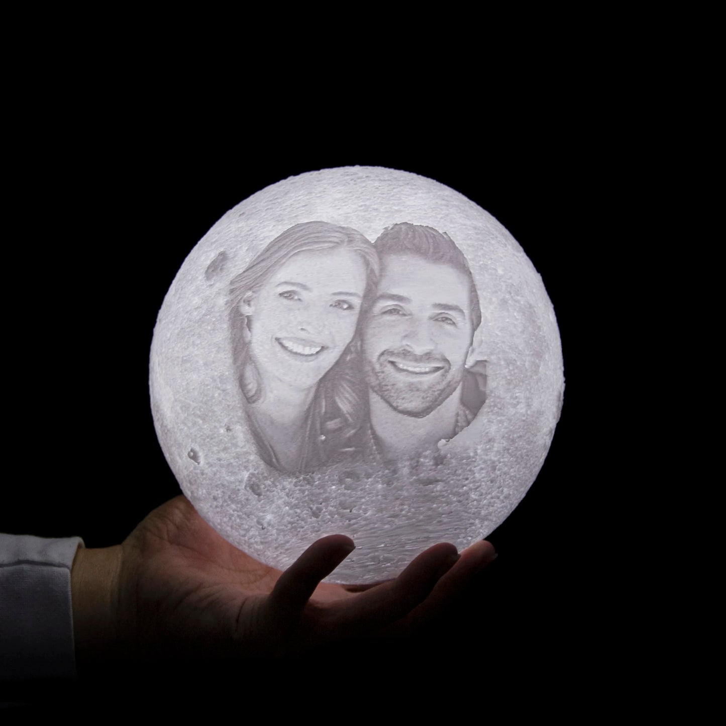 Romantic Night Light: Moon Lamp illuminating a dark room, highlighting the photo.