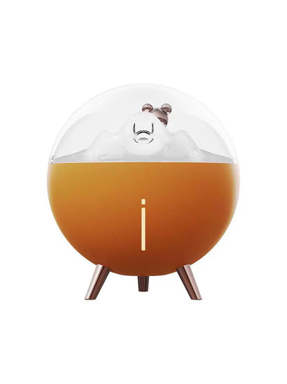 Space Bear Humidifier:Illuminated night light feature in a darkened room setting.