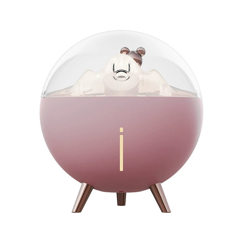 Space Bear Humidifier:Illuminated night light feature in a darkened room setting.