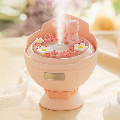 Pink Bouquet Humidifier displaying fine mist output in a bedroom setting.