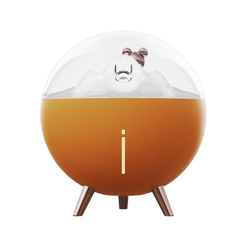 Space Bear Humidifier: Demonstrating the compact size next to a common object (e.g., a book).