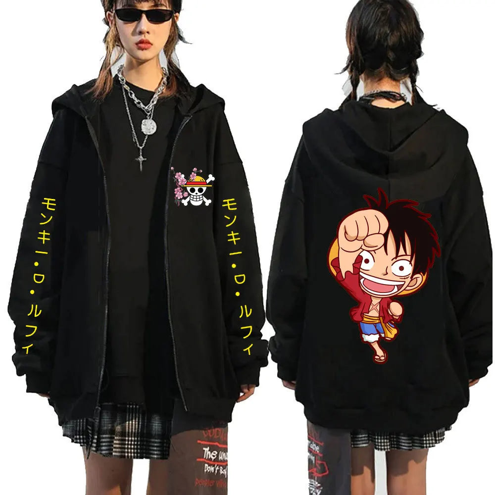 Close-up of Luffy print on black zip-up hoodie, detailed character art.