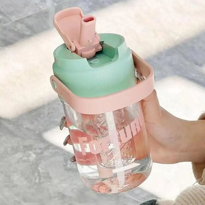 Pink 600ml reusable water bottle with straw, leak-proof design, made from eco-conscious materials.