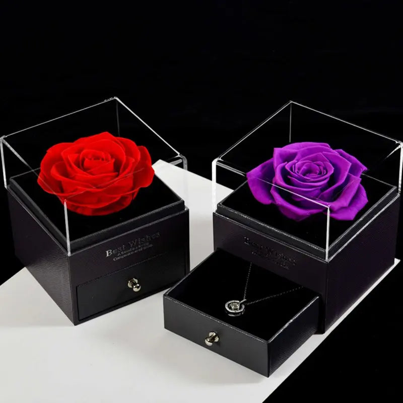 Preserved red rose in glass box, angled view, gift ribbon detail