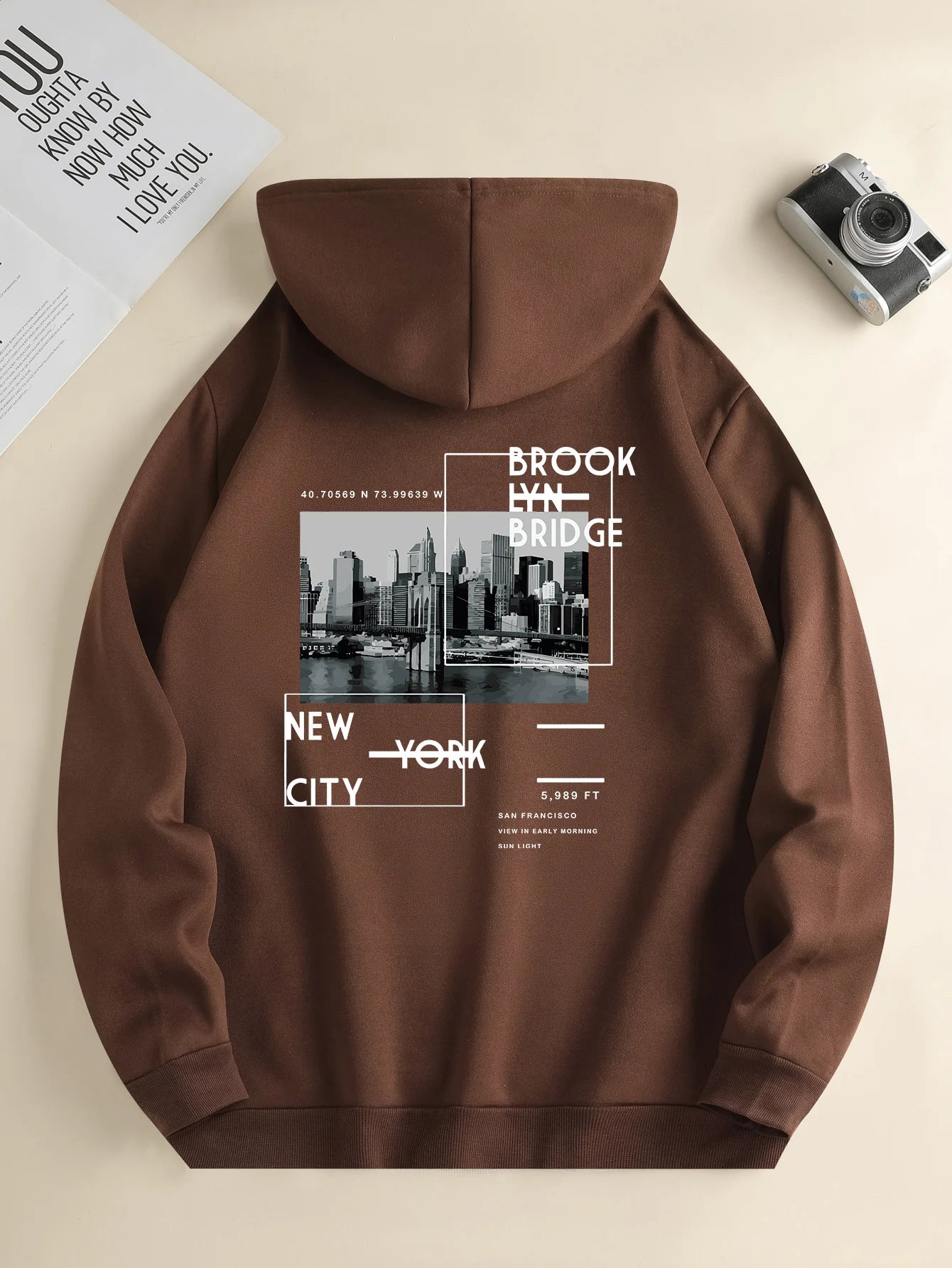 Men's hoodie with hood up, city print detail, perfect for him.