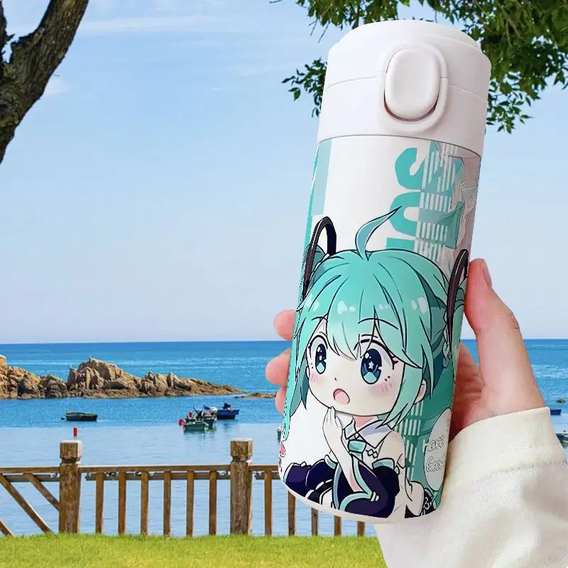 Hatsune Miku thermos in hand, demonstrating size, official Vocaloid merchandise.