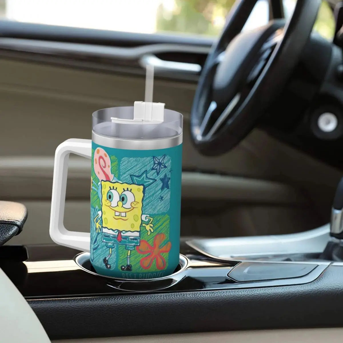 Spongebob Stainless Steel Tumbler: Child's hand gripping tumbler, demonstrating size and ease of use.