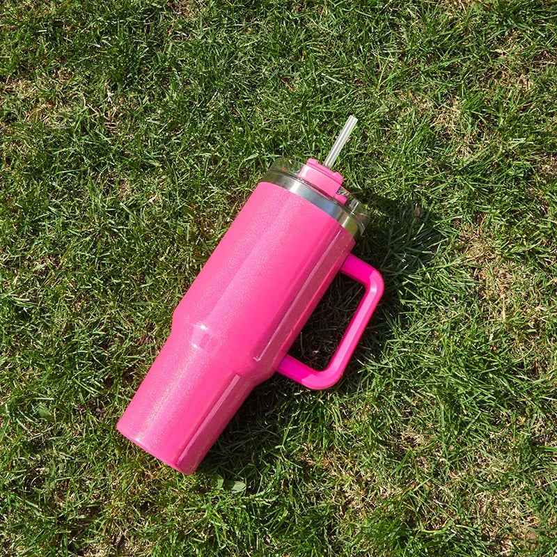 DUTRIEUX 40oz insulated tumbler, rainbow glitter, handle and straw, side view highlighting handle.