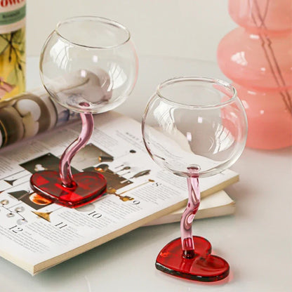 Pair of pink heart-shaped champagne flutes.