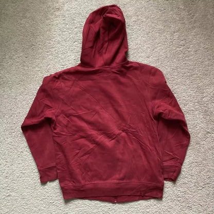 Side view of red Y2K couple hoodie, featuring zipper and hood.