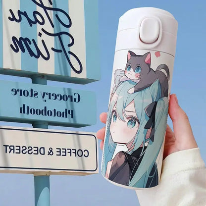 Hatsune Miku thermos, lid open, showing inner compartment, insulated design.