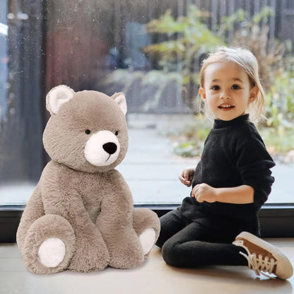 Side view of seated brown teddy bear, showing size and shape.