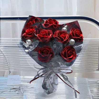 Top view of a dozen red soap roses in a heart-shaped gift box, tied with a satin ribbon