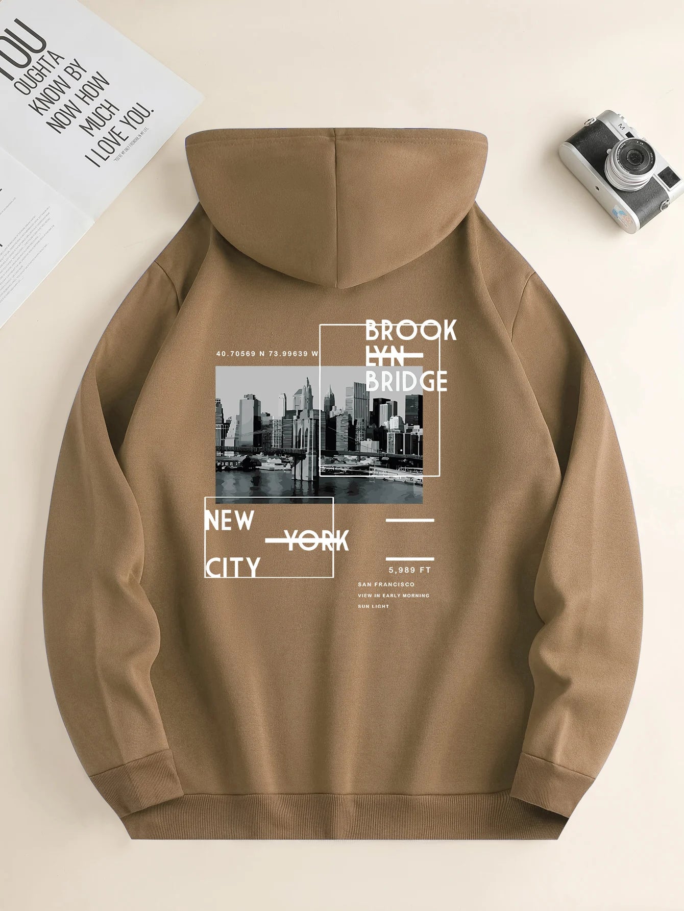 Side view, men's city print hoodie, stylish casual wear.