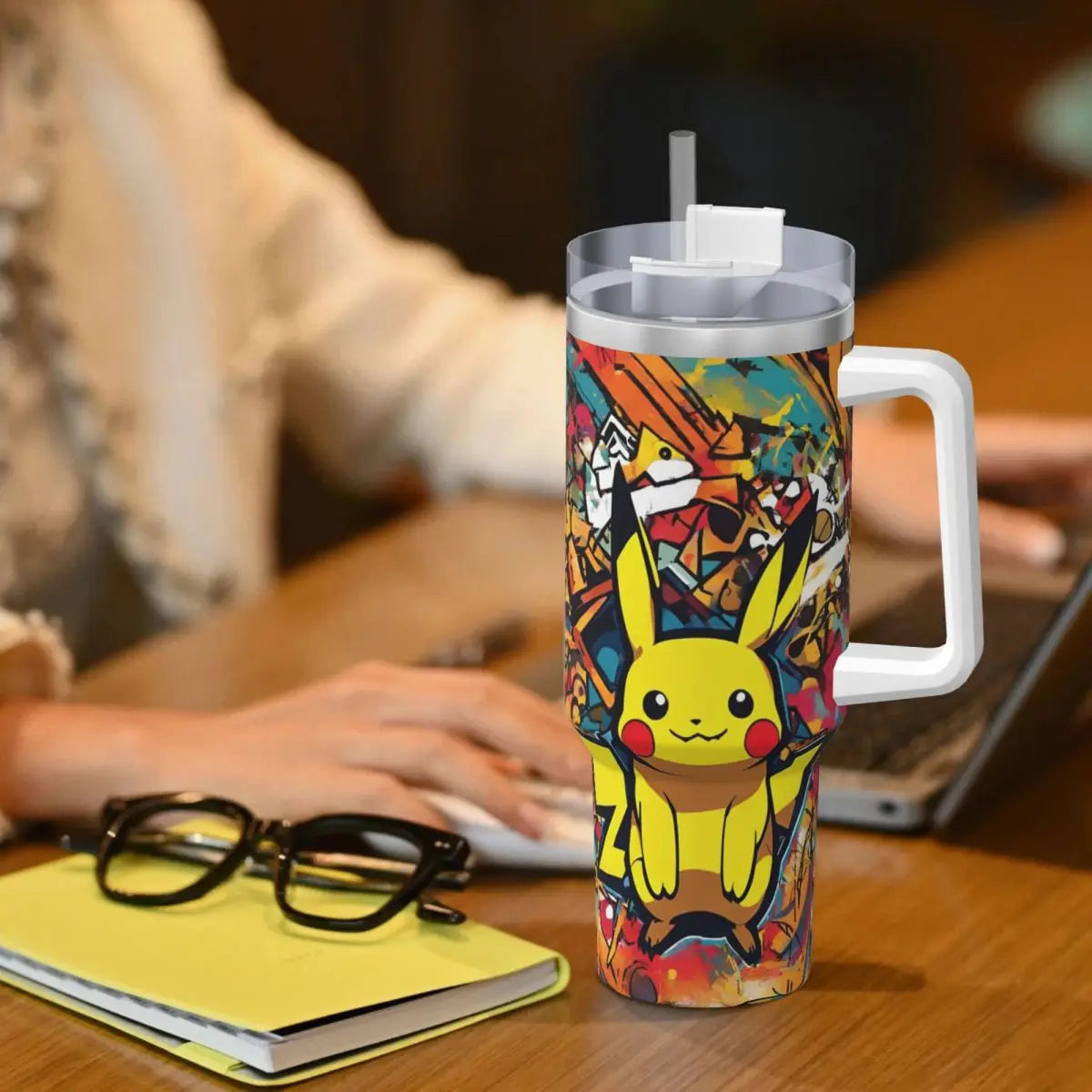 Pouring a refreshing drink into the Pokémon Stainless Steel Tumbler.The double-walled insulation keeps beverages at the perfect temperature. (Action shot highlighting the insulation benefit)