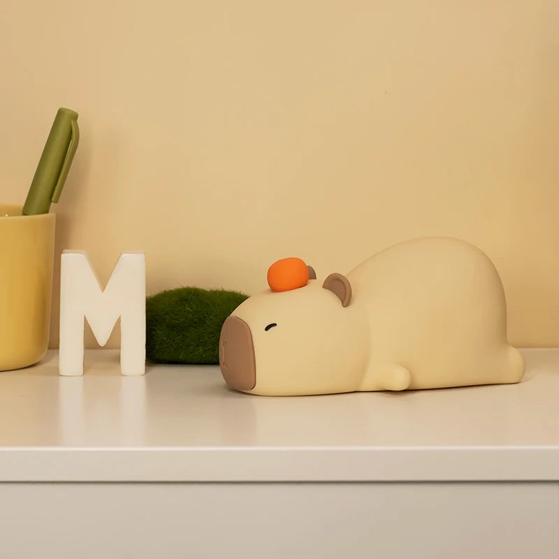 Capybara night light, soft silicone, warm white LED glow.