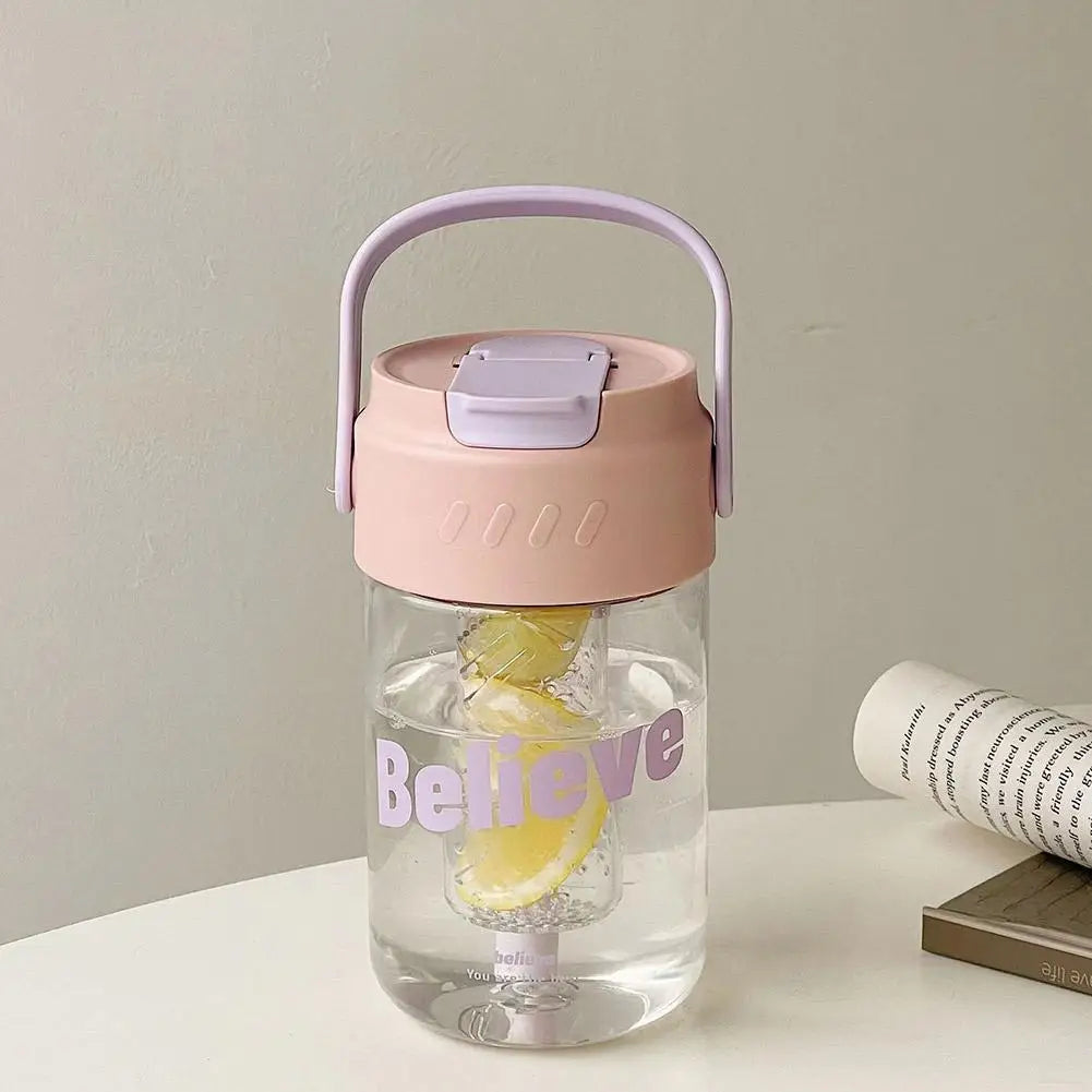 Eco-friendly pink water bottle, 600ml, with straw, spill-proof lid, and carry handle.