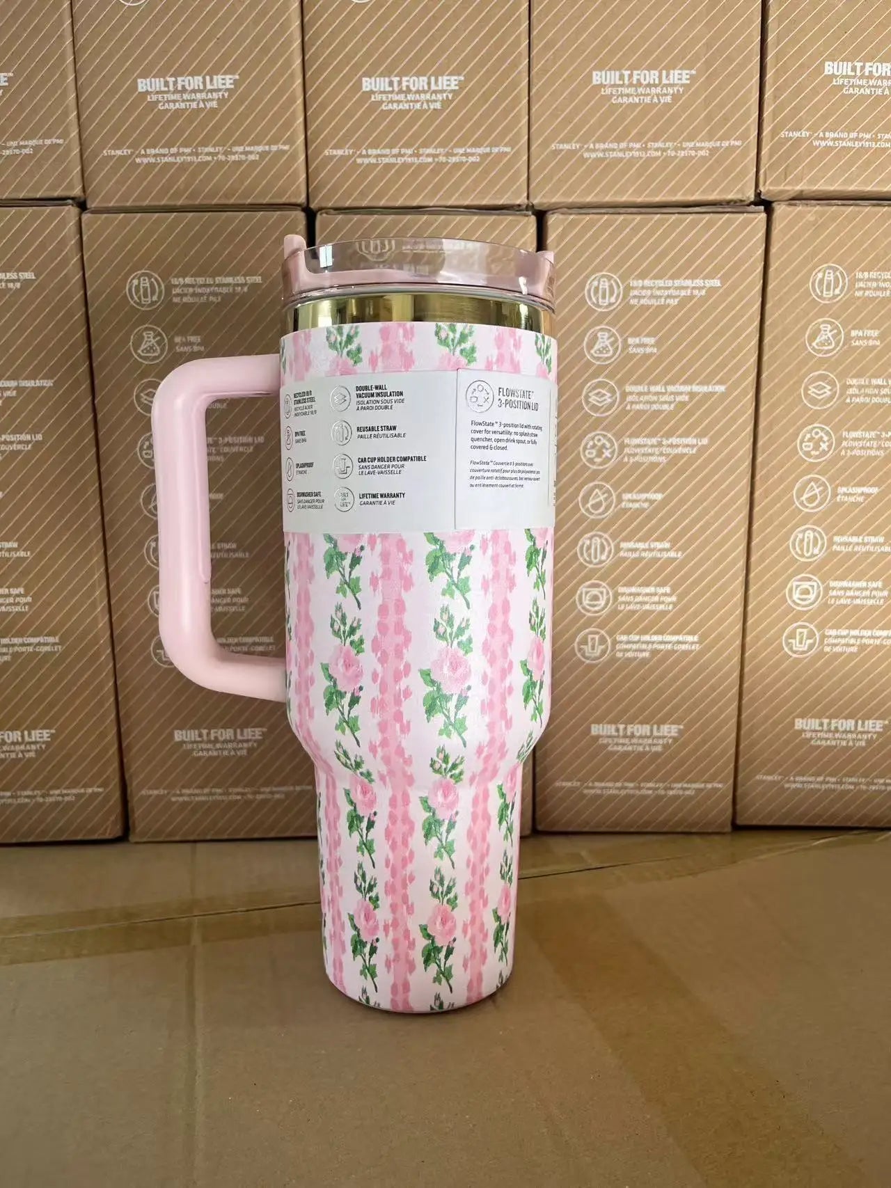 Side view of 30oz insulated travel mug, stainless steel, with straw lid, pink color.