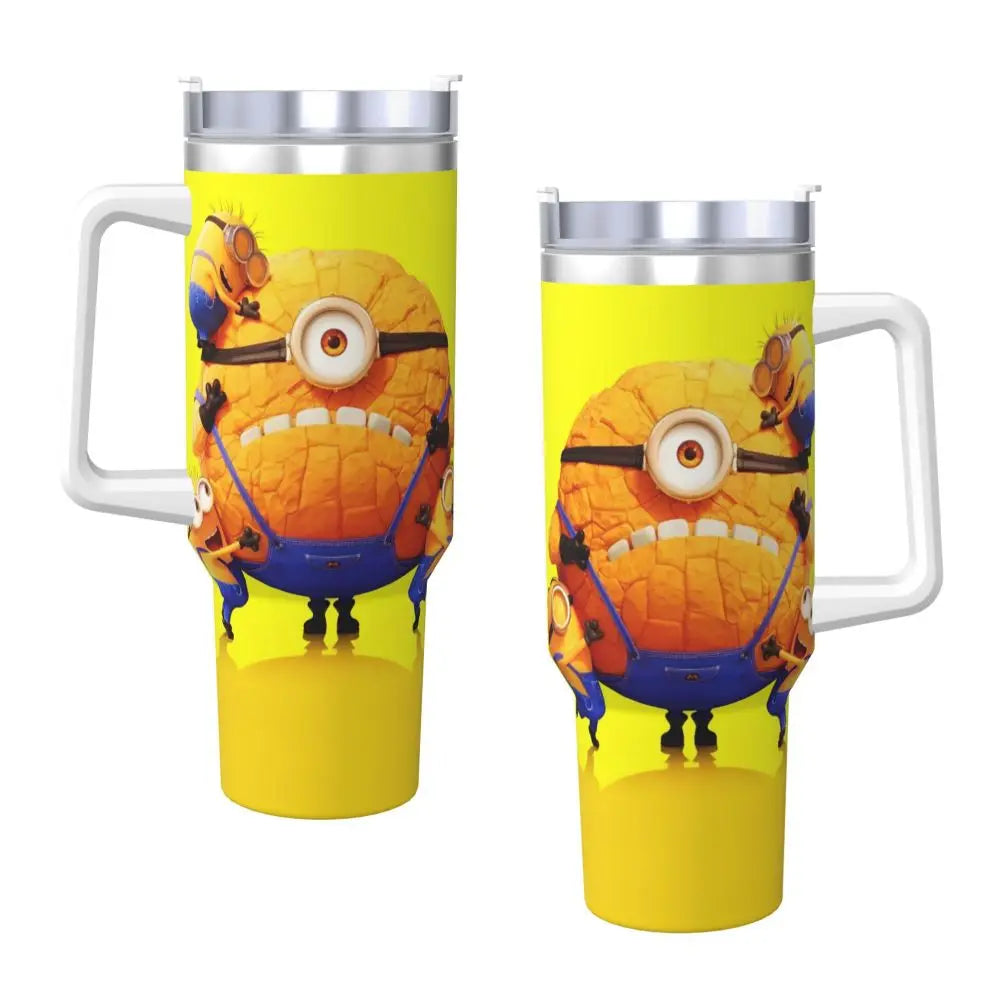 Minions travel mug, held in hand, showcasing size and design, with straw.