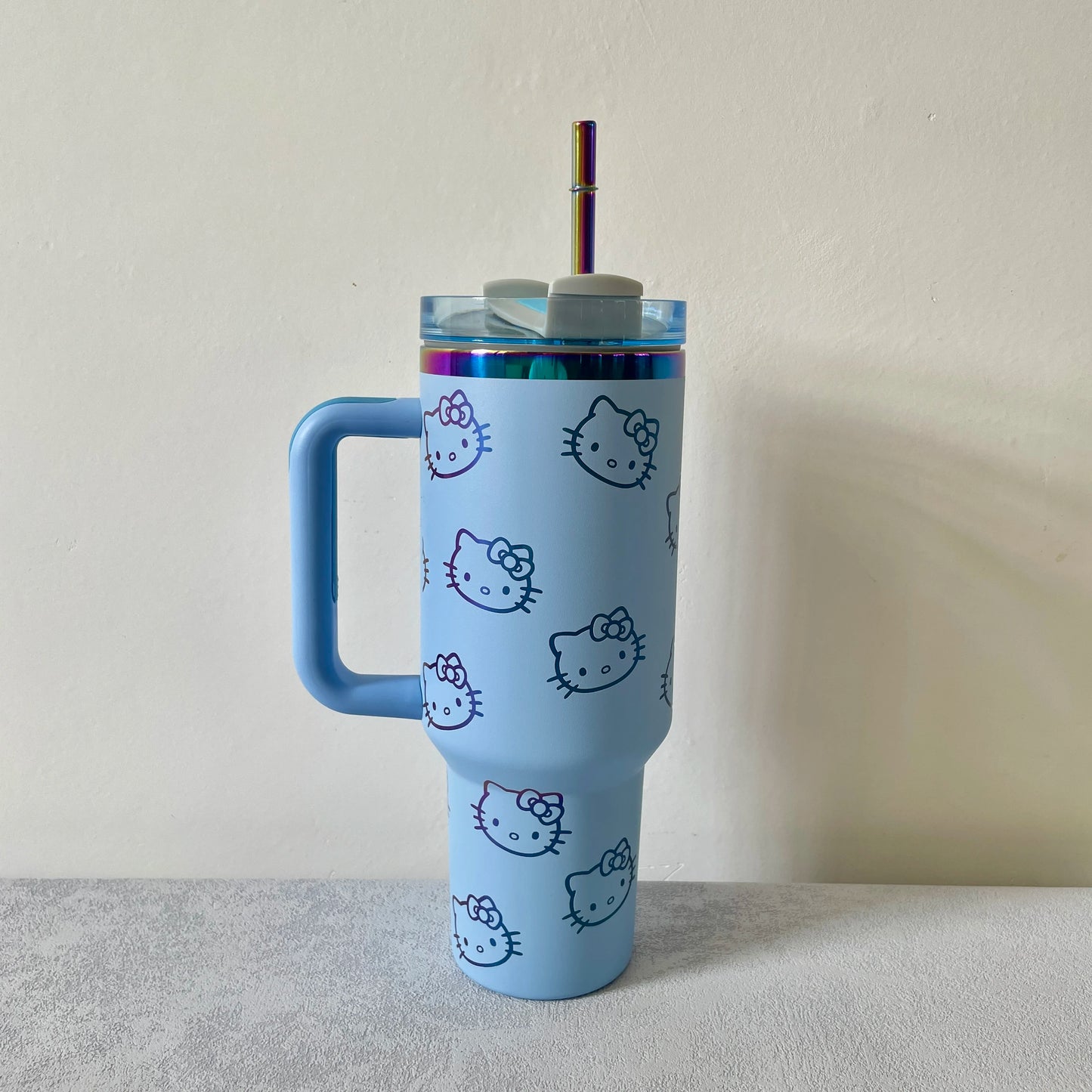 Hello Kitty insulated tumbler, 40oz, straw detail, side view.