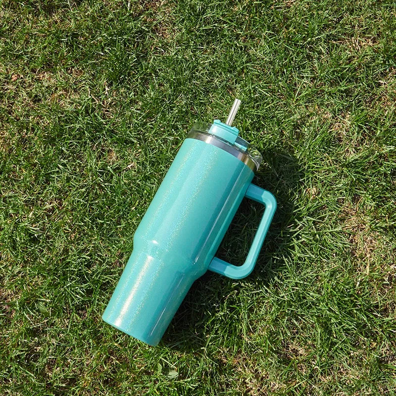 DUTRIEUX 40oz insulated tumbler with handle and straw, rainbow glitter, angled product shot.