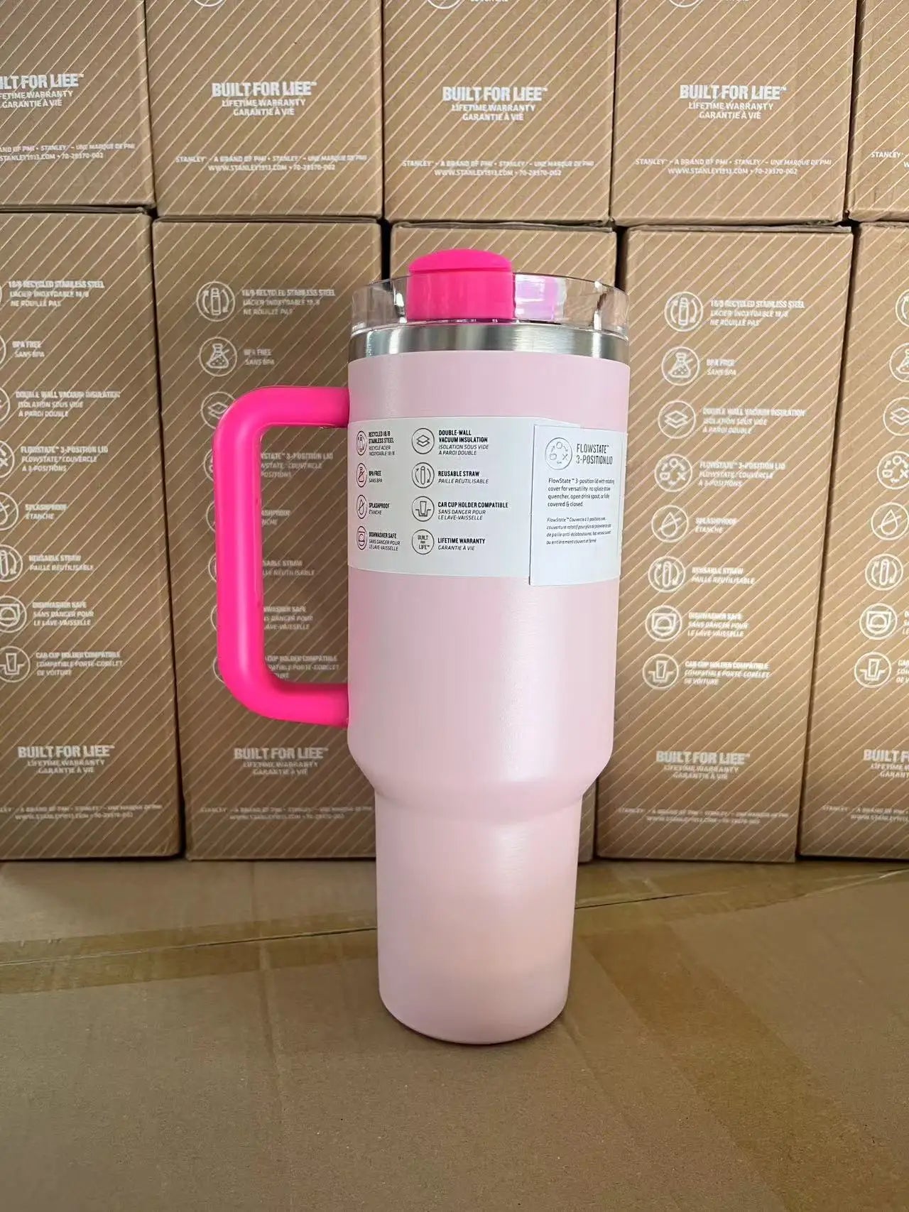 Side view of 30oz insulated travel mug, stainless steel, with straw lid, pink color.