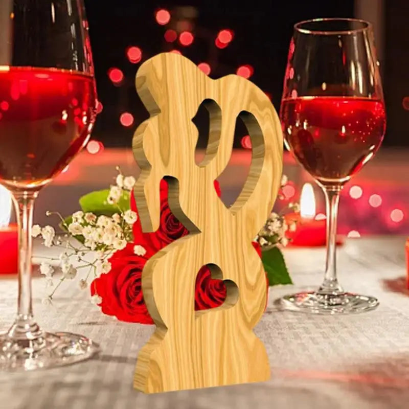 Wooden couple statue, close-up of intricate hand-carved details, Valentine's Day.