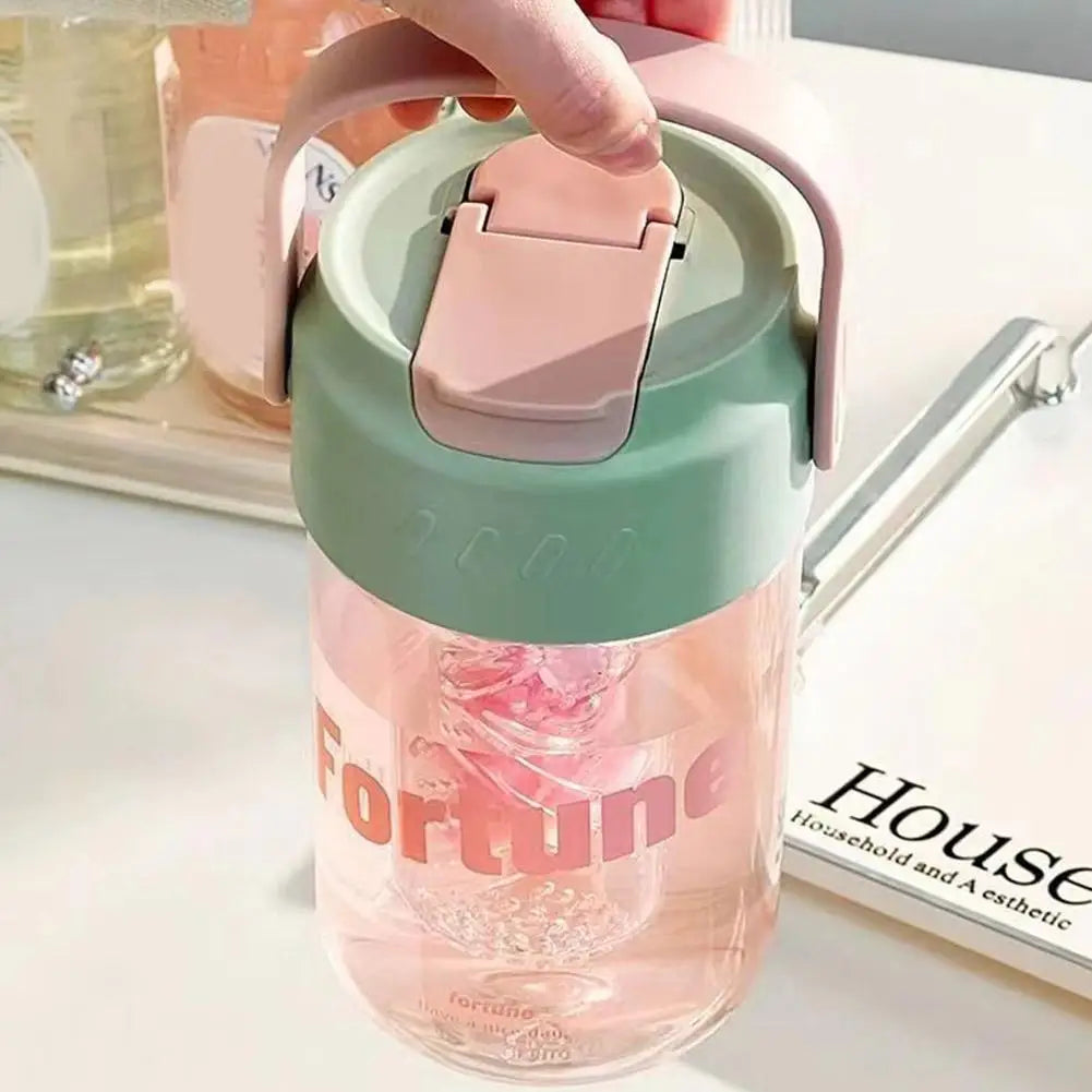 Pink 600ml reusable water bottle with straw, leak-proof design, made from eco-conscious materials.