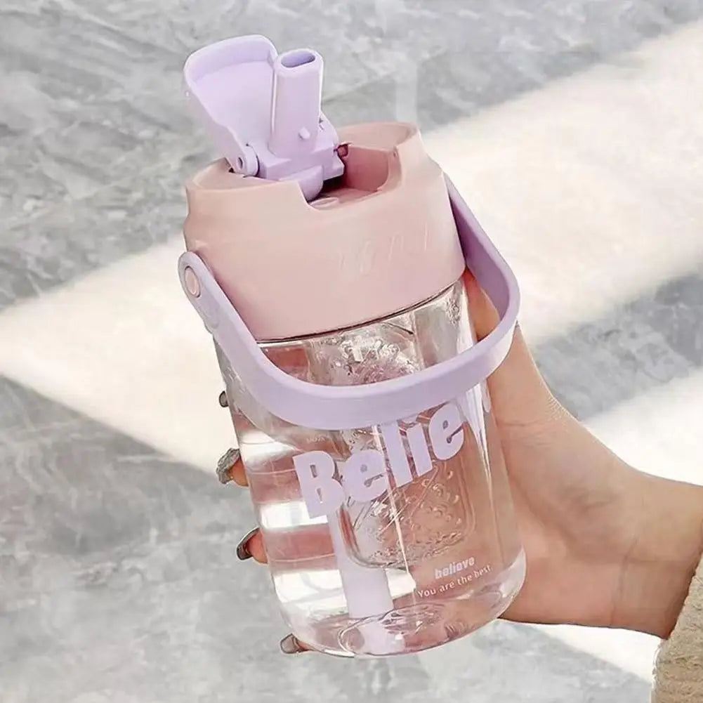 Eco-conscious pink water bottle, 600ml, includes straw, secure lid, and a practical carrying handle.