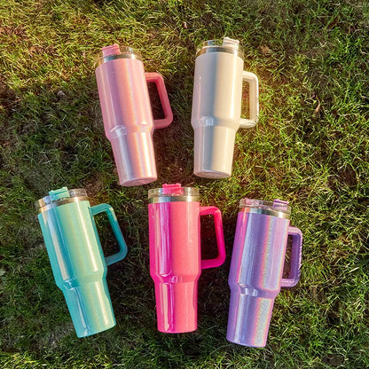 DUTRIEUX 40oz insulated tumbler with handle and straw, rainbow glitter, angled product shot.