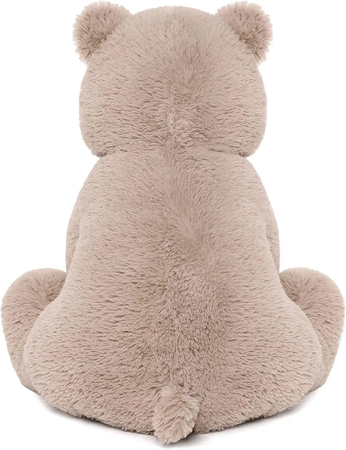 Teddy bear holding a small heart, ideal Valentine's Day gift.