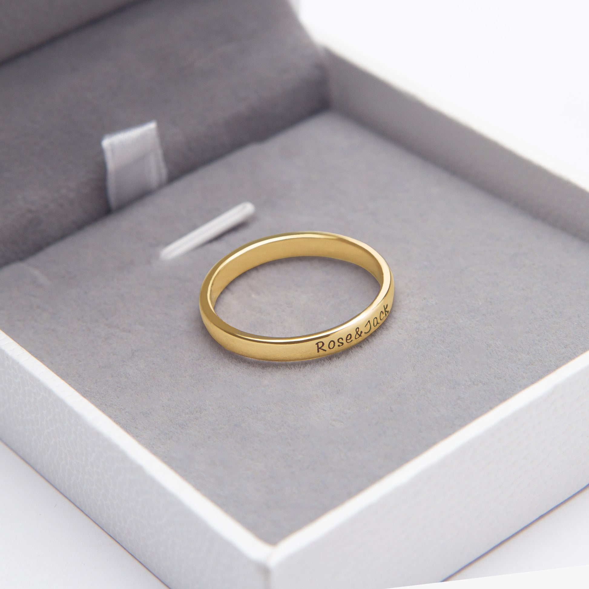 Dainty "Olivia" name ring in sterling silver, nestled in its elegant gift box, ready for gifting. (Focuses on a specific name example and the gift-giving aspect)