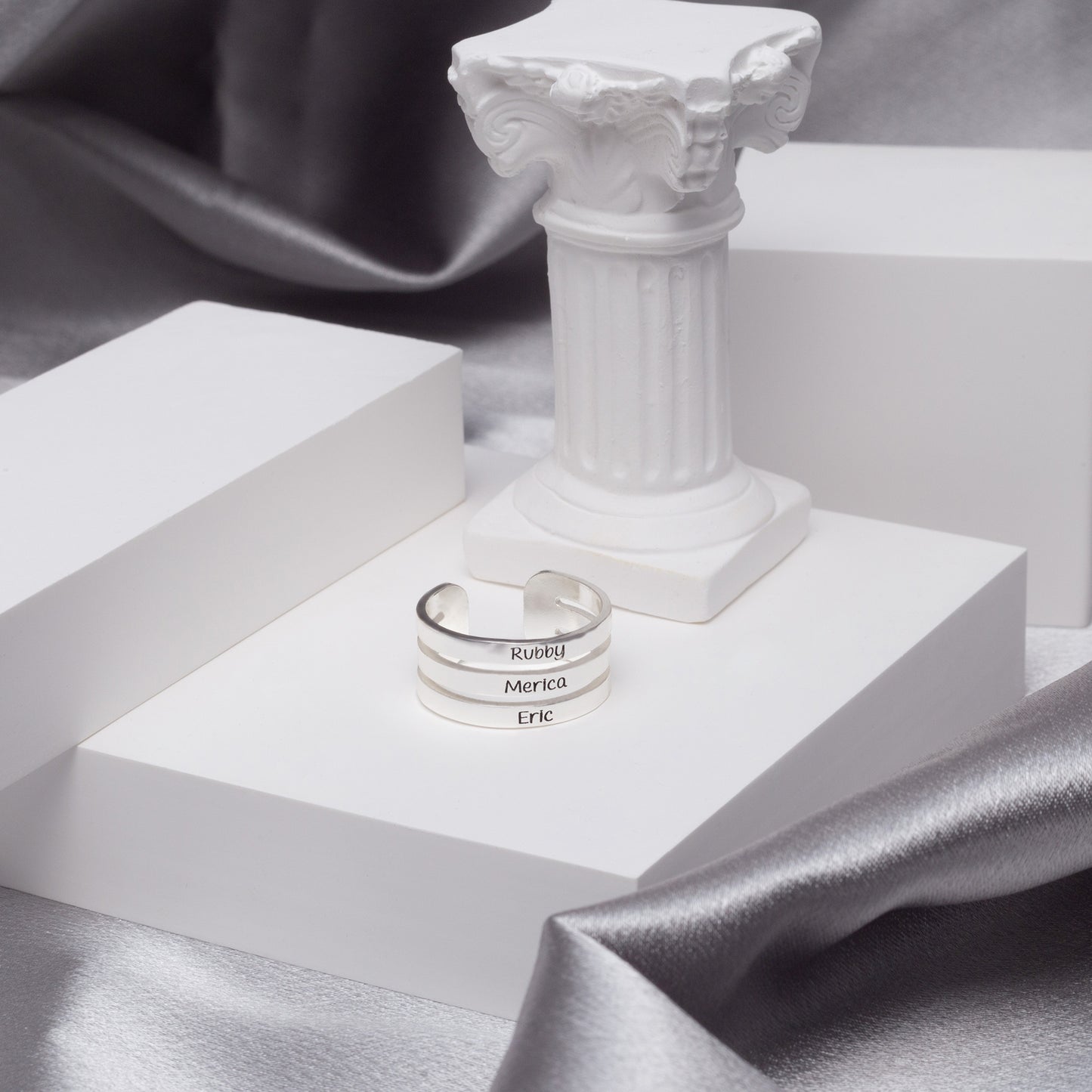 Three sterling silver stackable name rings with "Mom," "Grandma," and "Nana" engravings, a thoughtful gift for Mother's Day. (Illustrates multiple rings, specific engravings, and suggests a gifting occasion)