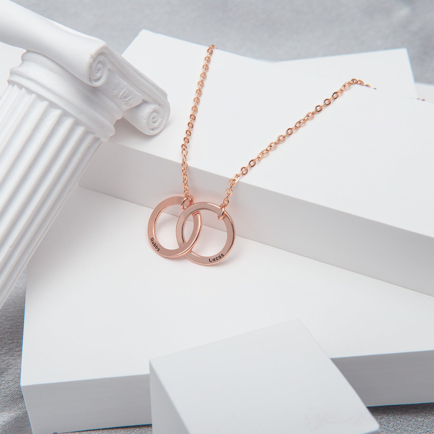 Close-up of sterling silver & copper interlocking circle necklace.Detail showcasing the handcrafted texture and dual-tone finish. (Focuses on material and craftsmanship, good for a close-up)