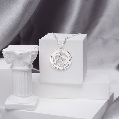 Lifestyle: Diamond heart in circle pendant necklace layered with other silver chains, creating a trendy, bohemian look. Perfect for everyday wear.