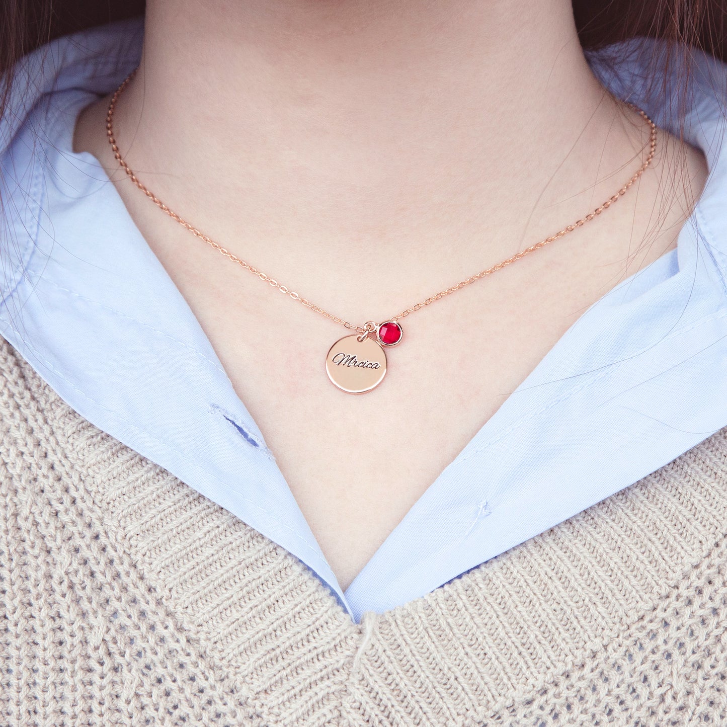 Unboxing a personalized [Birthstone Name/Color] birthstone necklace. The stainless steel circle pendant gleams inside the included gift box, ready for gifting. (Unique perspective, focuses on unboxing experience and gift-giving readiness)