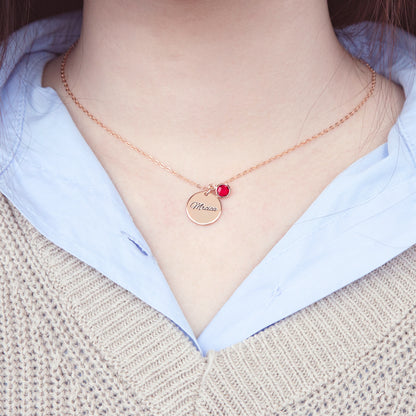 Unboxing a personalized [Birthstone Name/Color] birthstone necklace. The stainless steel circle pendant gleams inside the included gift box, ready for gifting. (Unique perspective, focuses on unboxing experience and gift-giving readiness)